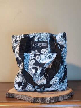 JanSport  Lunch Sack Black & White Floral Tote Bag